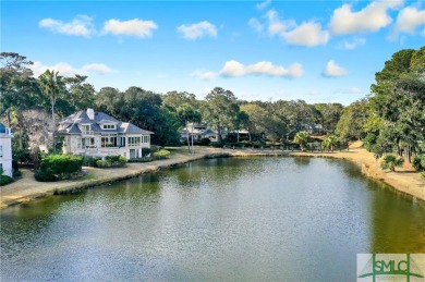 From stunning curb appeal to breathtaking views across 2 lagoons on The Landings Club - Palmetto in Georgia - for sale on GolfHomes.com, golf home, golf lot