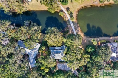 From stunning curb appeal to breathtaking views across 2 lagoons on The Landings Club - Palmetto in Georgia - for sale on GolfHomes.com, golf home, golf lot