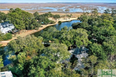 From stunning curb appeal to breathtaking views across 2 lagoons on The Landings Club - Palmetto in Georgia - for sale on GolfHomes.com, golf home, golf lot