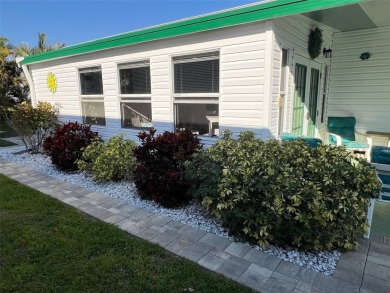 This stunning home, showcasing premium upgrades, is a on Palm Hill Golf Club in Florida - for sale on GolfHomes.com, golf home, golf lot