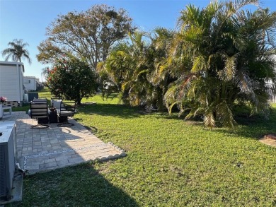 This stunning home, showcasing premium upgrades, is a on Palm Hill Golf Club in Florida - for sale on GolfHomes.com, golf home, golf lot