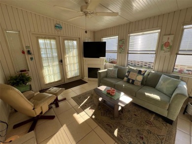 This stunning home, showcasing premium upgrades, is a on Palm Hill Golf Club in Florida - for sale on GolfHomes.com, golf home, golf lot