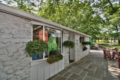 This exquisite mid-century ranch combines timeless design with on Buck Hill Golf Club  in Pennsylvania - for sale on GolfHomes.com, golf home, golf lot