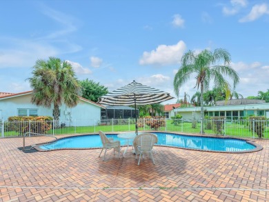 Spacious 3BR/2.5BA home in the prestigious Woodlands of Tamarac on Woodlands Country Club in Florida - for sale on GolfHomes.com, golf home, golf lot