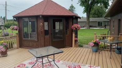 Nestled along the rolling greens of the golf course, this on Green Lea Golf Course in Minnesota - for sale on GolfHomes.com, golf home, golf lot