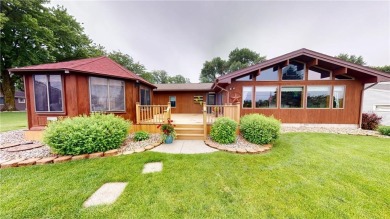 Nestled along the rolling greens of the golf course, this on Green Lea Golf Course in Minnesota - for sale on GolfHomes.com, golf home, golf lot