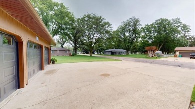 Nestled along the rolling greens of the golf course, this on Green Lea Golf Course in Minnesota - for sale on GolfHomes.com, golf home, golf lot