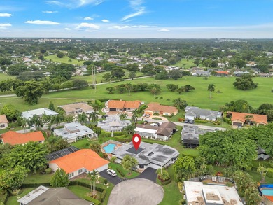 Spacious 3BR/2.5BA home in the prestigious Woodlands of Tamarac on Woodlands Country Club in Florida - for sale on GolfHomes.com, golf home, golf lot