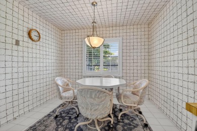 Elegant Country Club Living - Spacious 2-Bedroom + Den with Lake on Hunters Run Golf and Country Club in Florida - for sale on GolfHomes.com, golf home, golf lot
