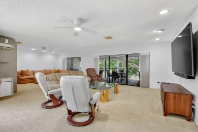 Elegant Country Club Living - Spacious 2-Bedroom + Den with Lake on Hunters Run Golf and Country Club in Florida - for sale on GolfHomes.com, golf home, golf lot