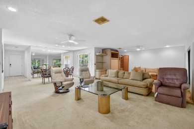 Elegant Country Club Living - Spacious 2-Bedroom + Den with Lake on Hunters Run Golf and Country Club in Florida - for sale on GolfHomes.com, golf home, golf lot