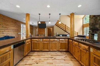 Stunning, custom-built log home overlooking the 16th tee & on Cedar River Golf Course in Michigan - for sale on GolfHomes.com, golf home, golf lot