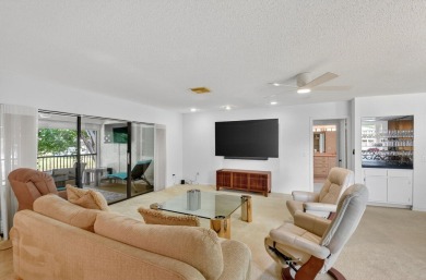Elegant Country Club Living - Spacious 2-Bedroom + Den with Lake on Hunters Run Golf and Country Club in Florida - for sale on GolfHomes.com, golf home, golf lot
