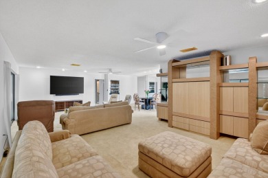Elegant Country Club Living - Spacious 2-Bedroom + Den with Lake on Hunters Run Golf and Country Club in Florida - for sale on GolfHomes.com, golf home, golf lot