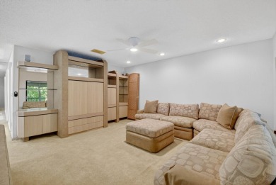 Elegant Country Club Living - Spacious 2-Bedroom + Den with Lake on Hunters Run Golf and Country Club in Florida - for sale on GolfHomes.com, golf home, golf lot