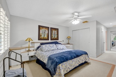 Elegant Country Club Living - Spacious 2-Bedroom + Den with Lake on Hunters Run Golf and Country Club in Florida - for sale on GolfHomes.com, golf home, golf lot