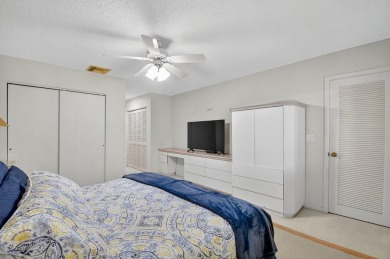 Elegant Country Club Living - Spacious 2-Bedroom + Den with Lake on Hunters Run Golf and Country Club in Florida - for sale on GolfHomes.com, golf home, golf lot