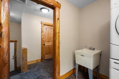 Stunning, custom-built log home overlooking the 16th tee & on Cedar River Golf Course in Michigan - for sale on GolfHomes.com, golf home, golf lot