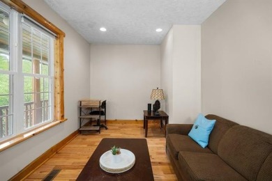 Stunning, custom-built log home overlooking the 16th tee & on Cedar River Golf Course in Michigan - for sale on GolfHomes.com, golf home, golf lot