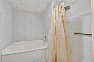 Elegant Country Club Living - Spacious 2-Bedroom + Den with Lake on Hunters Run Golf and Country Club in Florida - for sale on GolfHomes.com, golf home, golf lot