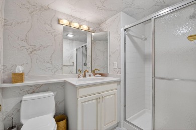 Elegant Country Club Living - Spacious 2-Bedroom + Den with Lake on Hunters Run Golf and Country Club in Florida - for sale on GolfHomes.com, golf home, golf lot