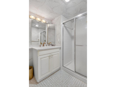 Elegant Country Club Living - Spacious 2-Bedroom + Den with Lake on Hunters Run Golf and Country Club in Florida - for sale on GolfHomes.com, golf home, golf lot