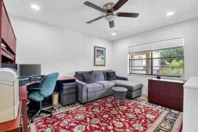 Elegant Country Club Living - Spacious 2-Bedroom + Den with Lake on Hunters Run Golf and Country Club in Florida - for sale on GolfHomes.com, golf home, golf lot