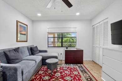 Elegant Country Club Living - Spacious 2-Bedroom + Den with Lake on Hunters Run Golf and Country Club in Florida - for sale on GolfHomes.com, golf home, golf lot