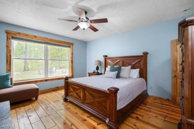 Stunning, custom-built log home overlooking the 16th tee & on Cedar River Golf Course in Michigan - for sale on GolfHomes.com, golf home, golf lot
