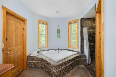 Stunning, custom-built log home overlooking the 16th tee & on Cedar River Golf Course in Michigan - for sale on GolfHomes.com, golf home, golf lot