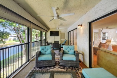Elegant Country Club Living - Spacious 2-Bedroom + Den with Lake on Hunters Run Golf and Country Club in Florida - for sale on GolfHomes.com, golf home, golf lot