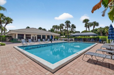 Elegant Country Club Living - Spacious 2-Bedroom + Den with Lake on Hunters Run Golf and Country Club in Florida - for sale on GolfHomes.com, golf home, golf lot