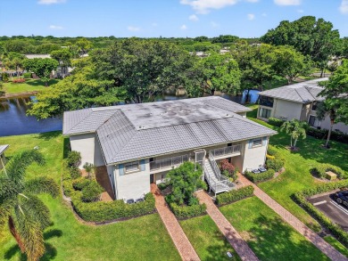 Elegant Country Club Living - Spacious 2-Bedroom + Den with Lake on Hunters Run Golf and Country Club in Florida - for sale on GolfHomes.com, golf home, golf lot