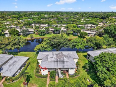 Elegant Country Club Living - Spacious 2-Bedroom + Den with Lake on Hunters Run Golf and Country Club in Florida - for sale on GolfHomes.com, golf home, golf lot