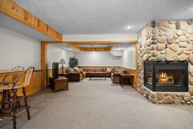 Stunning, custom-built log home overlooking the 16th tee & on Cedar River Golf Course in Michigan - for sale on GolfHomes.com, golf home, golf lot