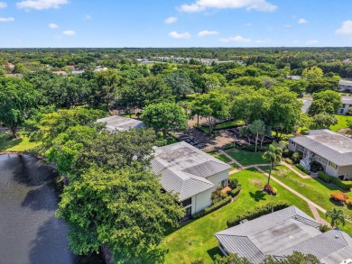 Elegant Country Club Living - Spacious 2-Bedroom + Den with Lake on Hunters Run Golf and Country Club in Florida - for sale on GolfHomes.com, golf home, golf lot