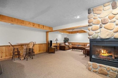 Stunning, custom-built log home overlooking the 16th tee & on Cedar River Golf Course in Michigan - for sale on GolfHomes.com, golf home, golf lot