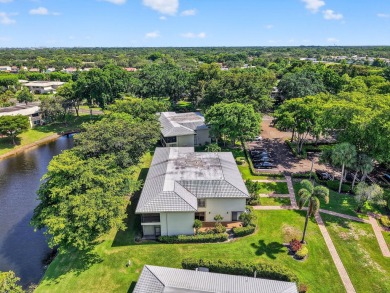 Elegant Country Club Living - Spacious 2-Bedroom + Den with Lake on Hunters Run Golf and Country Club in Florida - for sale on GolfHomes.com, golf home, golf lot