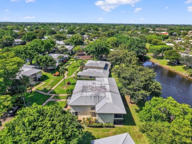 Elegant Country Club Living - Spacious 2-Bedroom + Den with Lake on Hunters Run Golf and Country Club in Florida - for sale on GolfHomes.com, golf home, golf lot