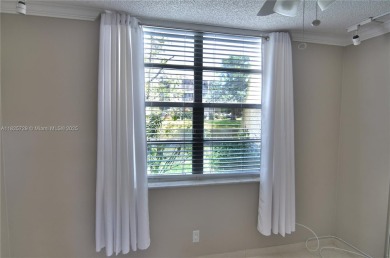 BEAUTIFUL 2 BED, 2 BATH FIRST FLOOR CONDO W GORGEOUS WATER VIEWS on Pine Island Ridge Country Club in Florida - for sale on GolfHomes.com, golf home, golf lot