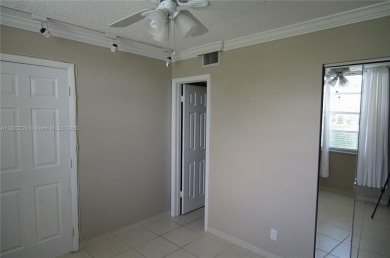 BEAUTIFUL 2 BED, 2 BATH FIRST FLOOR CONDO W GORGEOUS WATER VIEWS on Pine Island Ridge Country Club in Florida - for sale on GolfHomes.com, golf home, golf lot