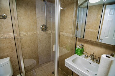 BEAUTIFUL 2 BED, 2 BATH FIRST FLOOR CONDO W GORGEOUS WATER VIEWS on Pine Island Ridge Country Club in Florida - for sale on GolfHomes.com, golf home, golf lot
