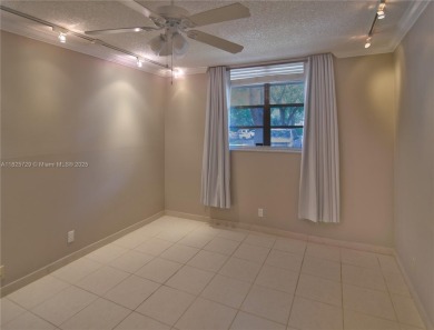 BEAUTIFUL 2 BED, 2 BATH FIRST FLOOR CONDO W GORGEOUS WATER VIEWS on Pine Island Ridge Country Club in Florida - for sale on GolfHomes.com, golf home, golf lot