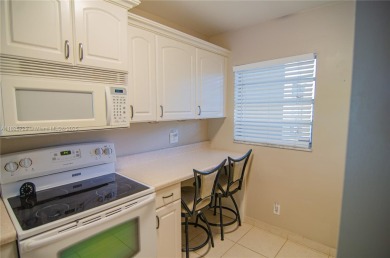 BEAUTIFUL 2 BED, 2 BATH FIRST FLOOR CONDO W GORGEOUS WATER VIEWS on Pine Island Ridge Country Club in Florida - for sale on GolfHomes.com, golf home, golf lot