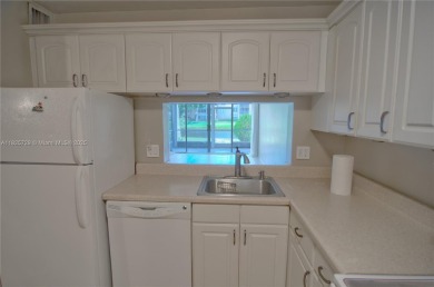 BEAUTIFUL 2 BED, 2 BATH FIRST FLOOR CONDO W GORGEOUS WATER VIEWS on Pine Island Ridge Country Club in Florida - for sale on GolfHomes.com, golf home, golf lot