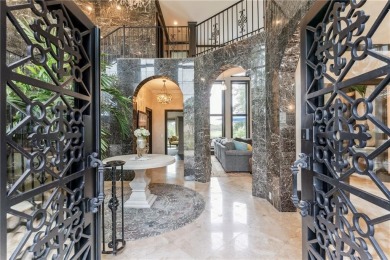This stunning residence blends timeless European elegance with on Oak Grove Island Golf and Country Club in Georgia - for sale on GolfHomes.com, golf home, golf lot