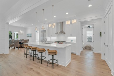 This elegant single-story Hawthorne plan by Huff Homes combines on Origins Golf Club in Florida - for sale on GolfHomes.com, golf home, golf lot