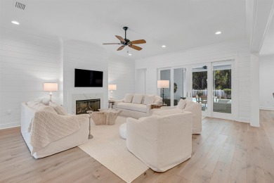 This elegant single-story Hawthorne plan by Huff Homes combines on Origins Golf Club in Florida - for sale on GolfHomes.com, golf home, golf lot