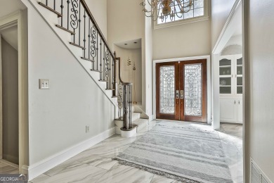 Welcome to this exquisite Stoney Brook home offering 5 bedrooms on Canongate At Flat Creek Club in Georgia - for sale on GolfHomes.com, golf home, golf lot