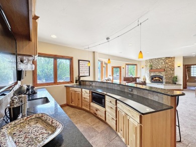 Set back on a flat 2-acre lot overlooking the 3rd Fairway at the on Pole Creek Golf Club in Colorado - for sale on GolfHomes.com, golf home, golf lot
